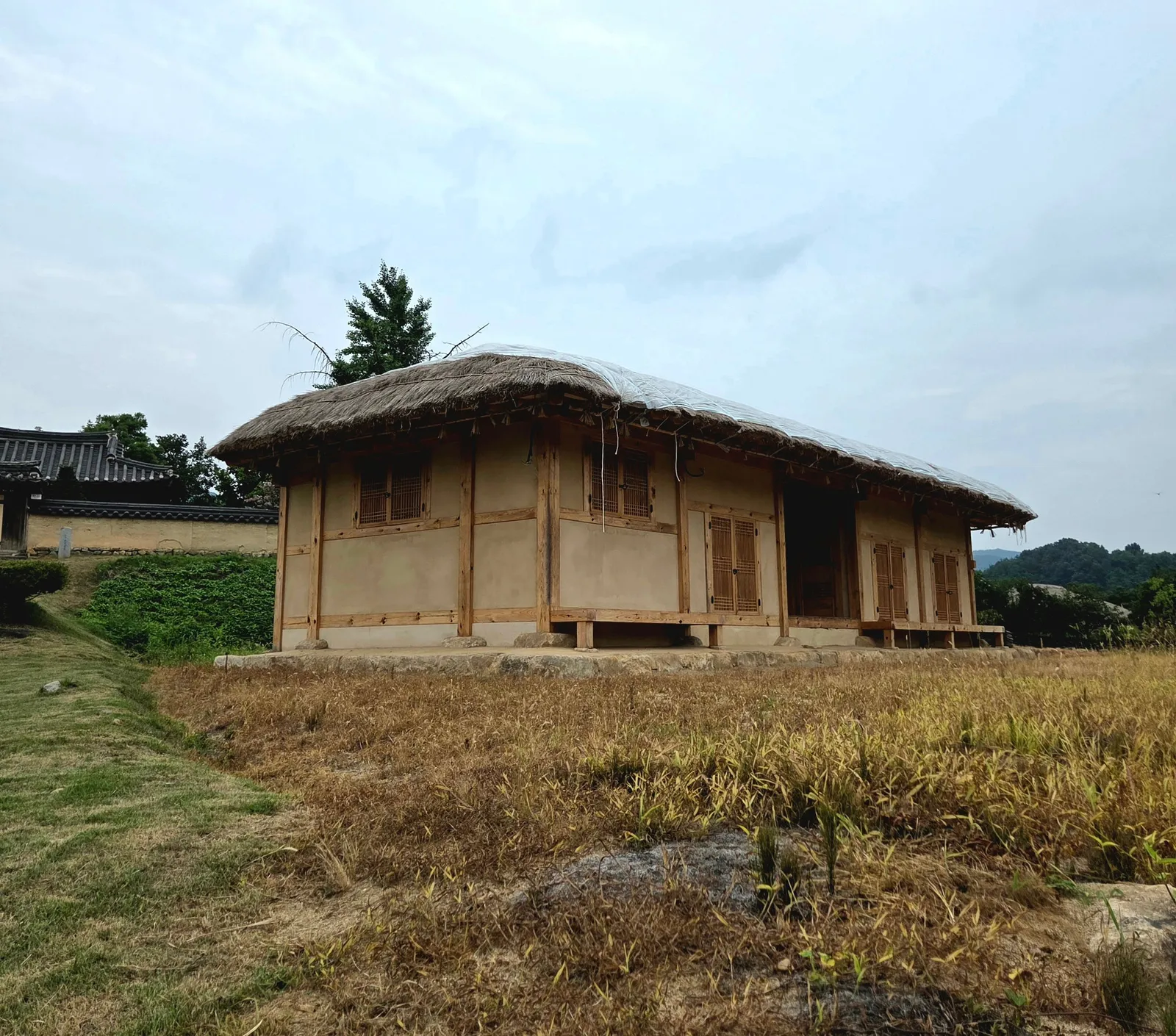 A thatched roofed traditional house in the Hahoe folk village near Andong, South Korea