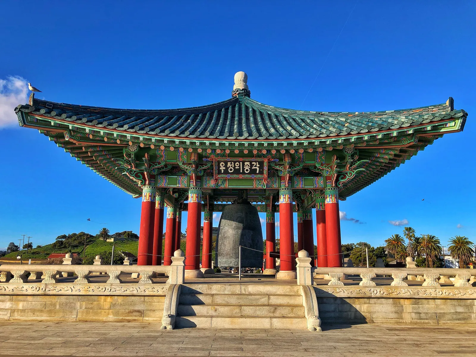 A traditional pavilion holding a large bell near the demilitarised zone, South Korea
