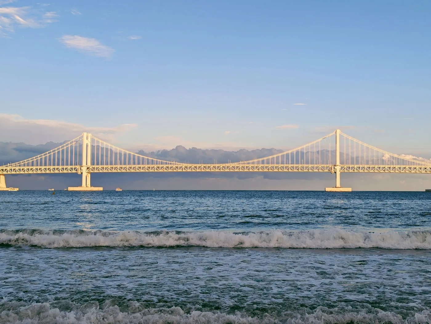 The Gwangan suspension bridge seen across the water from the beach in Busan, South Korea