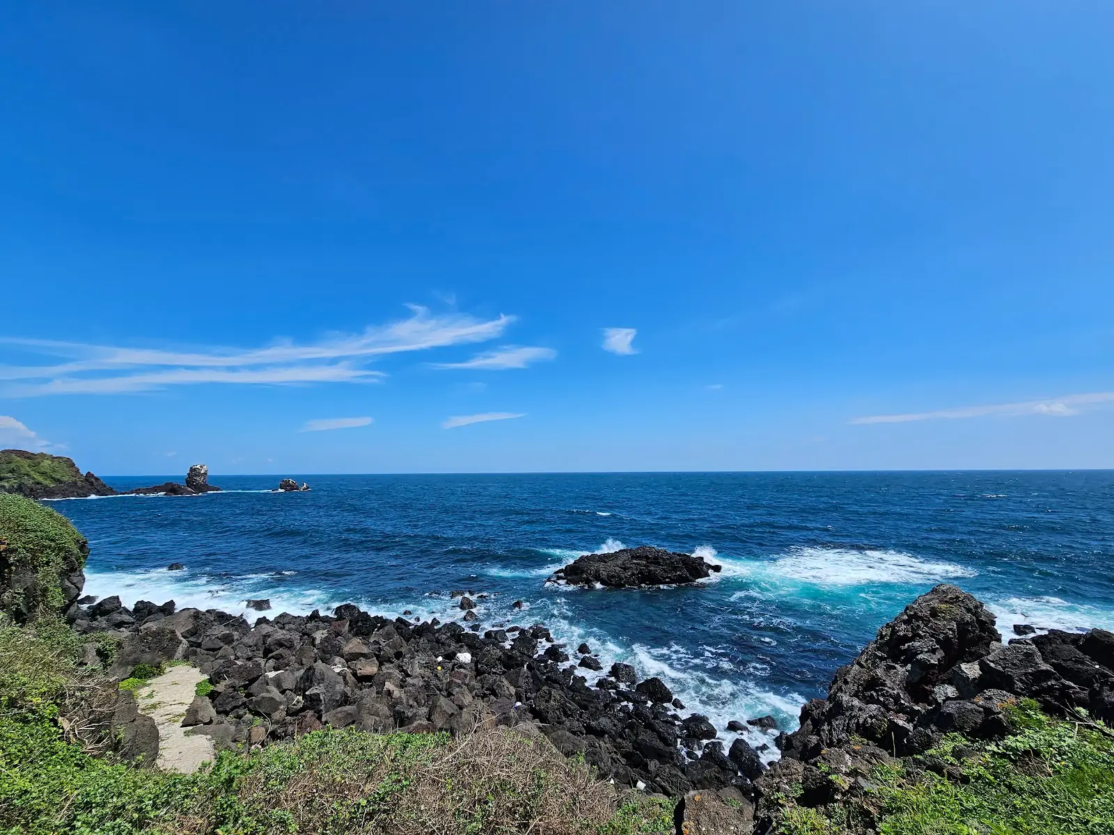 Seogwipo south coast waterfront in South Korea with cliffs and sea