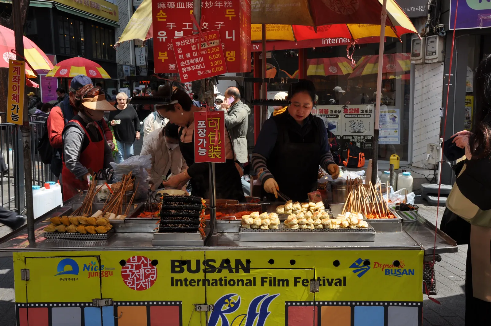 A street food stall with skewers and snacks at a market in Busan, South Korea