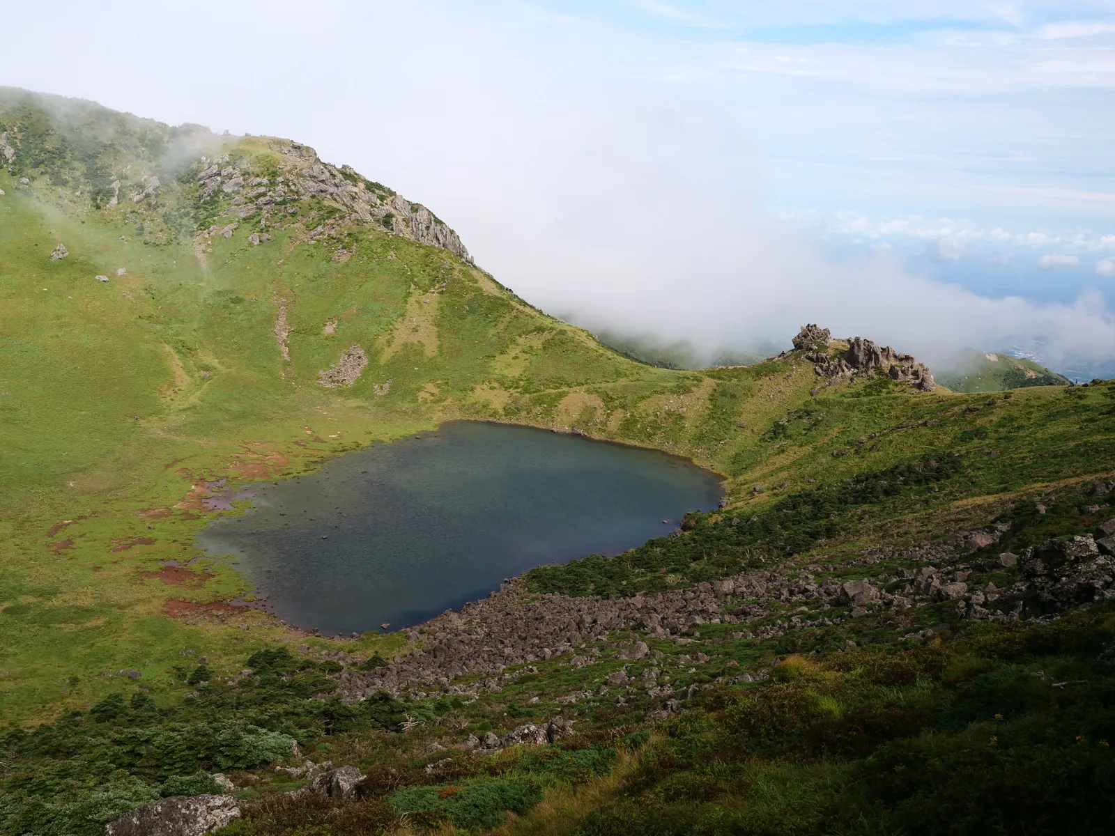 The crater lake in the summit caldera of Hallasan with cloud around the rim, Jeju, South Korea