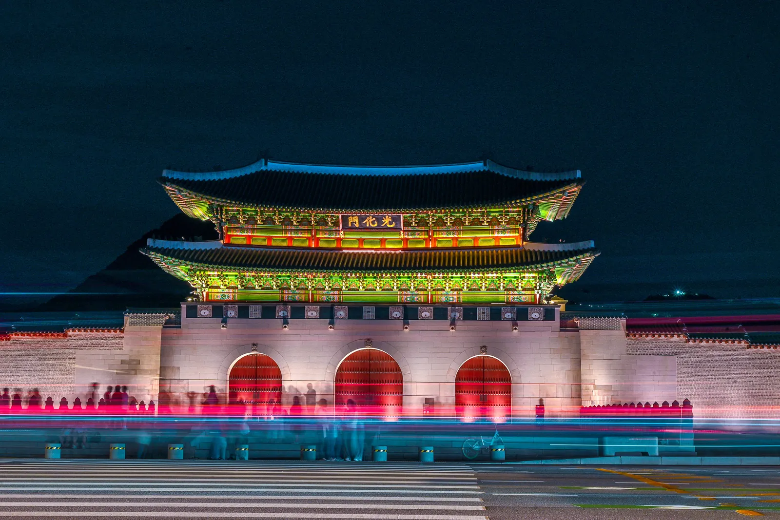 Gwanghwamun Gate at Gyeongbokgung Palace lit up at night in Seoul, South Korea