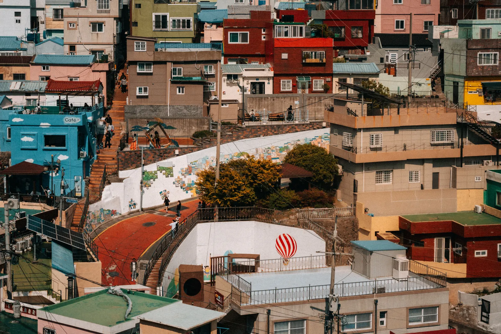 A painted stone stairway lined with murals on a hillside in Ihwa Mural Village, Seoul, South Korea