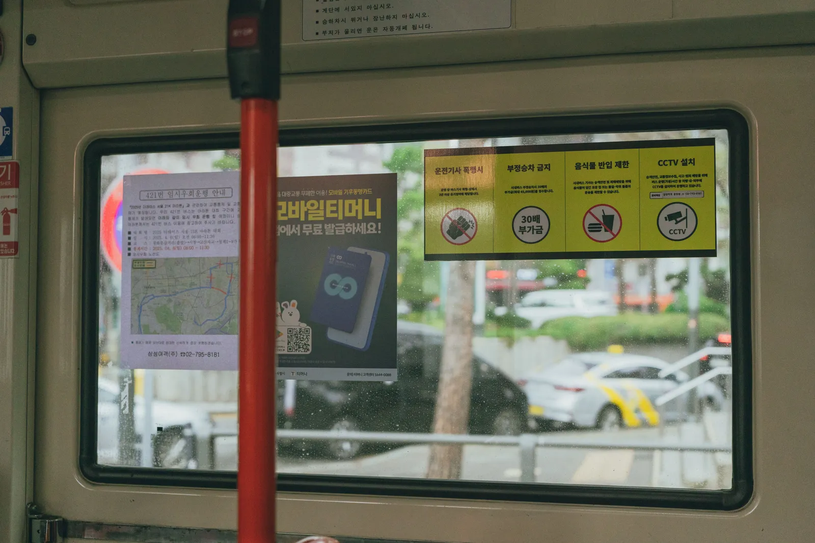 Korean language signage and a route map at a bus stop in Seoul, South Korea