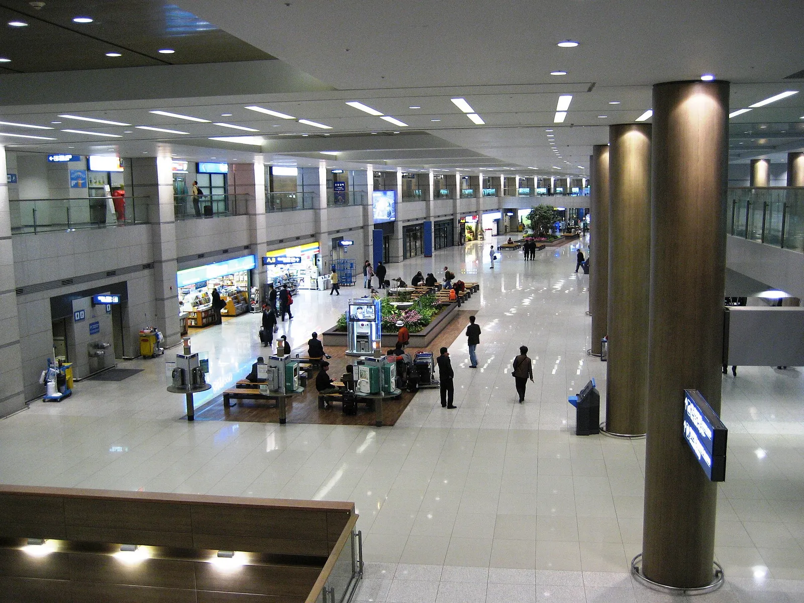 The arrival hall of Incheon International Airport in South Korea with passengers and luggage trolleys