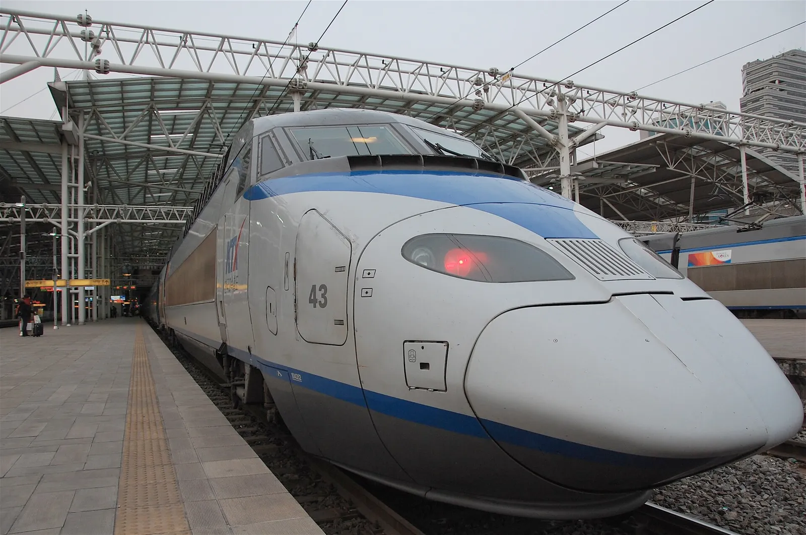 A KTX high-speed train waiting at a station platform in South Korea