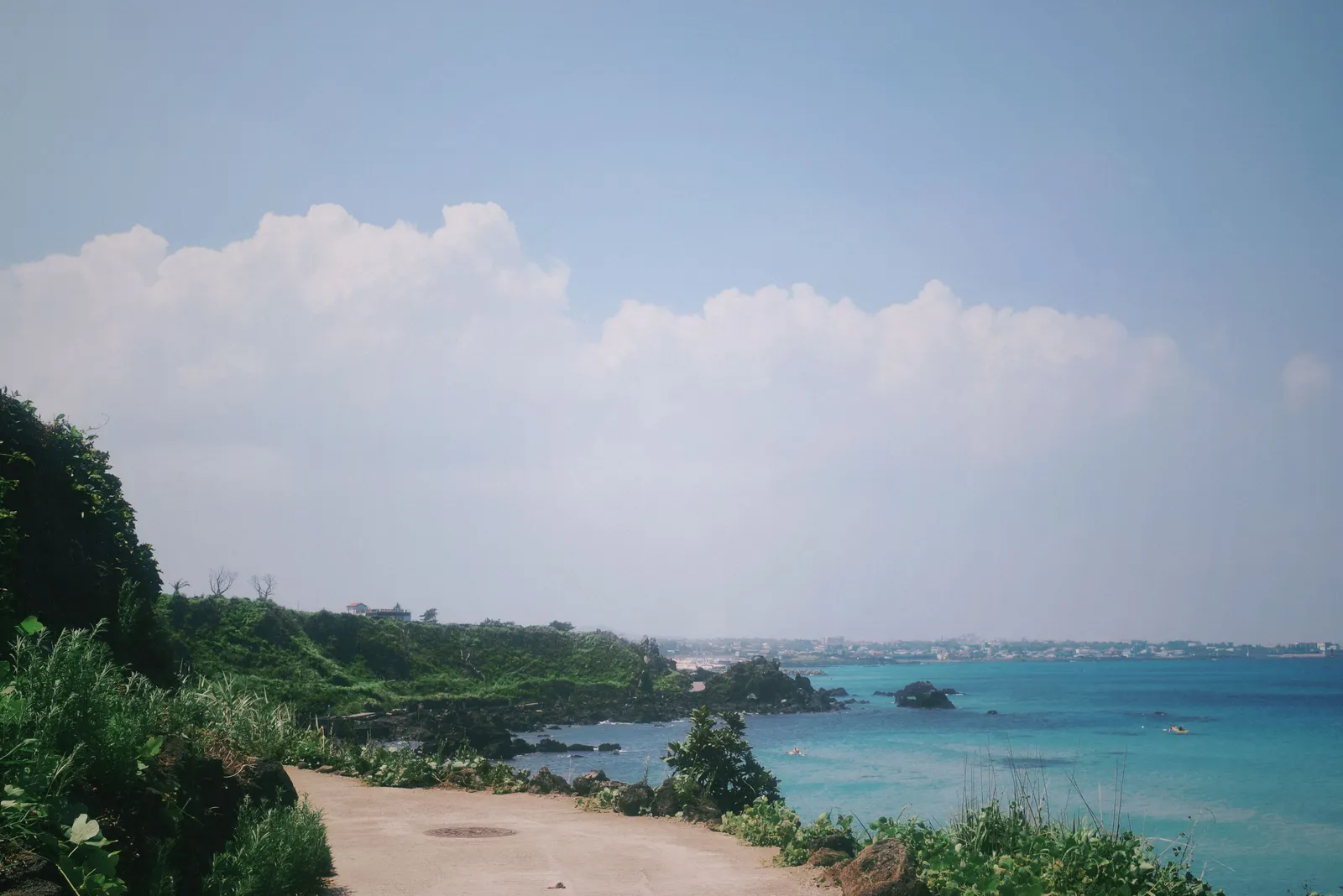 A coastal walking path above the sea on Jeju island, South Korea