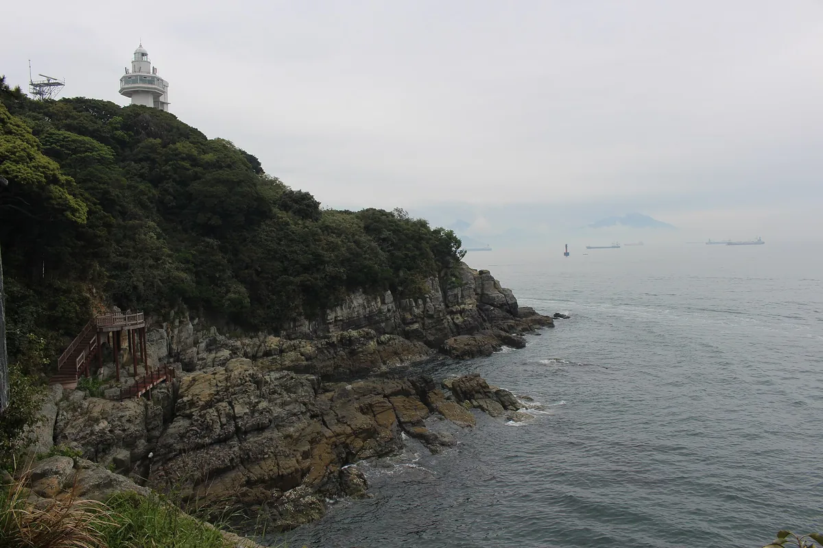 The wooded rocky headland of Odongdo, with the lighthouse at the top