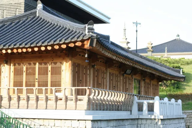 A museum building in traditional style with a tiled roof and a paved forecourt