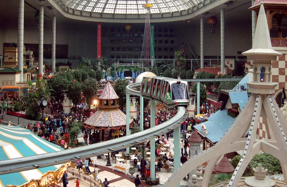 The indoor park at Lotte World, with the castle and the monorail passing above it