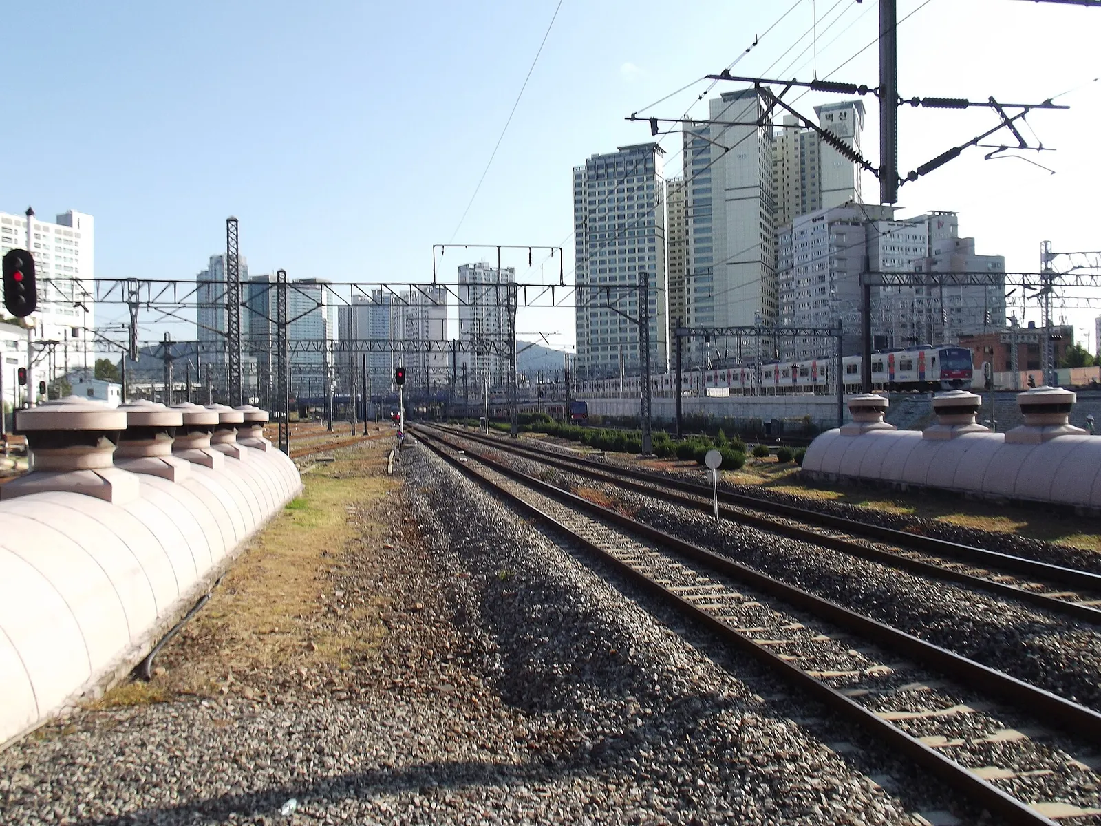 Railway tracks running into Seoul with the city skyline behind them in South Korea