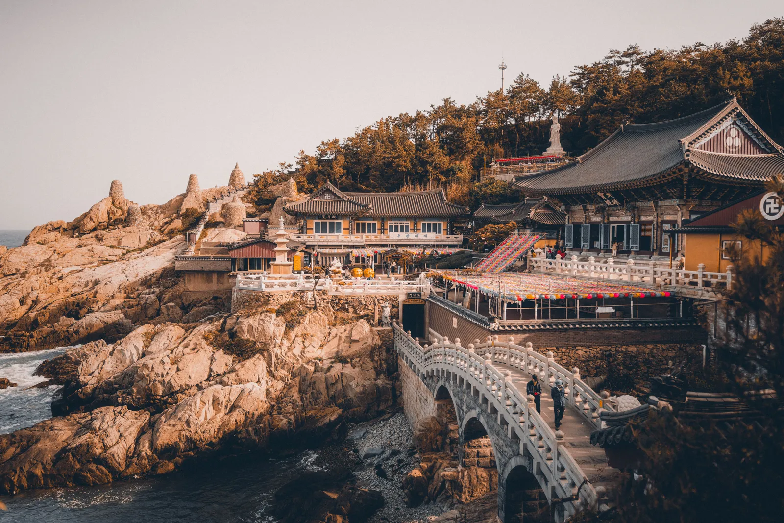 Haedong Yonggungsa temple buildings on the rocky coastline with the sea beyond, Busan